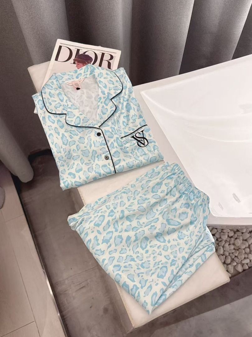 Victoria's Secret Blue Leopard Silk Pyjama Set (Category: Undergarments & Loungewear) located in Quezon City. Submitted by jennabartl92045 (Listing ID 1467657985, Image 1). Description: - Brand: Victoria's Secret - Material: Soft, lightweight, and breathable satin fabric - Design: Chic light blue and white animal print - Top: Short sleeve, button-down, chest pocket with embroidered VS monogram, and piping trim - Bottoms: Long trousers with a comf