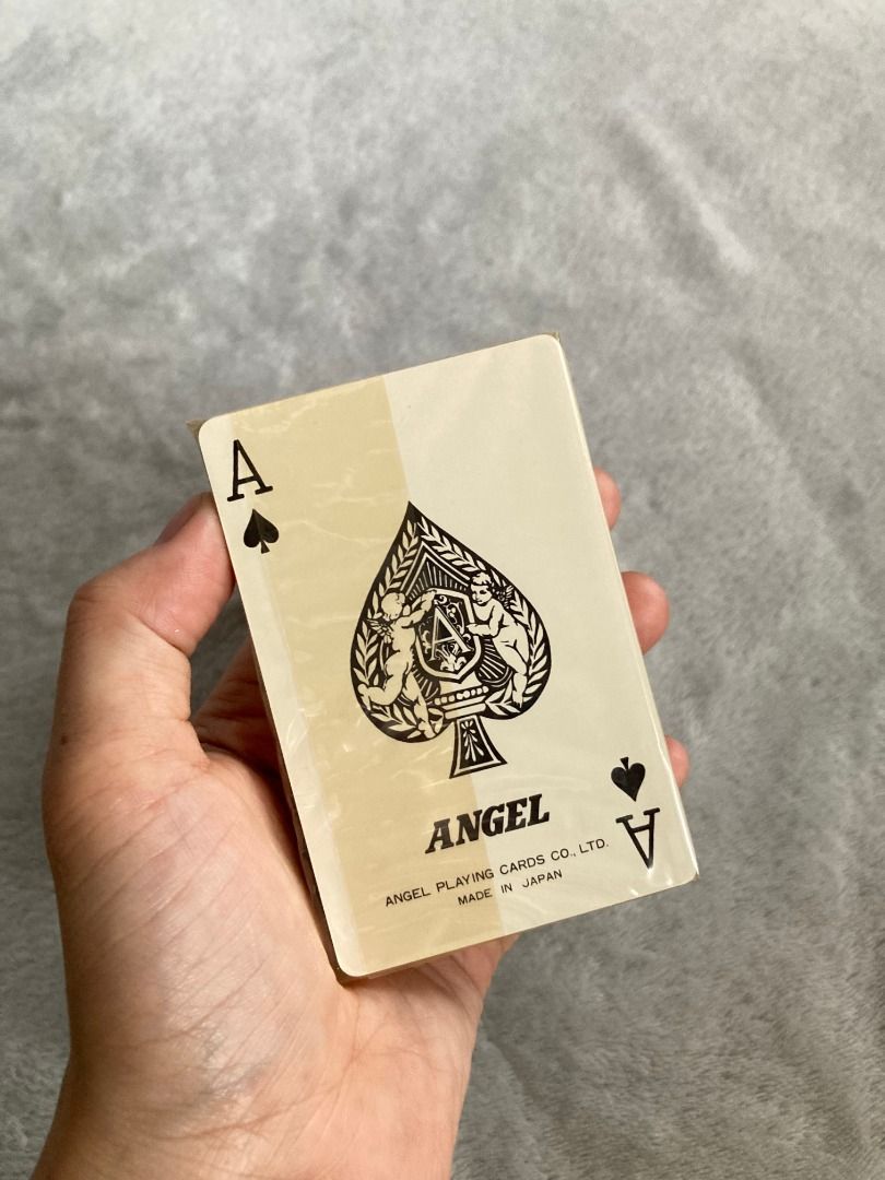 Vintage Angel Playing Cards (Category: Vintage Collectibles) located in Rizal. Submitted by sheeraay (Listing ID 1467704524, Image 2). Description: - Brand: Angel Playing Cards Co., Ltd. (Made in Japan) - Condition: Brand new, factory sealed in original clear plastic wrap - Inclusion: Comes with original outer paper sleeve and hard black plastic case - Design: Features charming cherubs on the Ace of Spades - Type: Standard vintage deck.