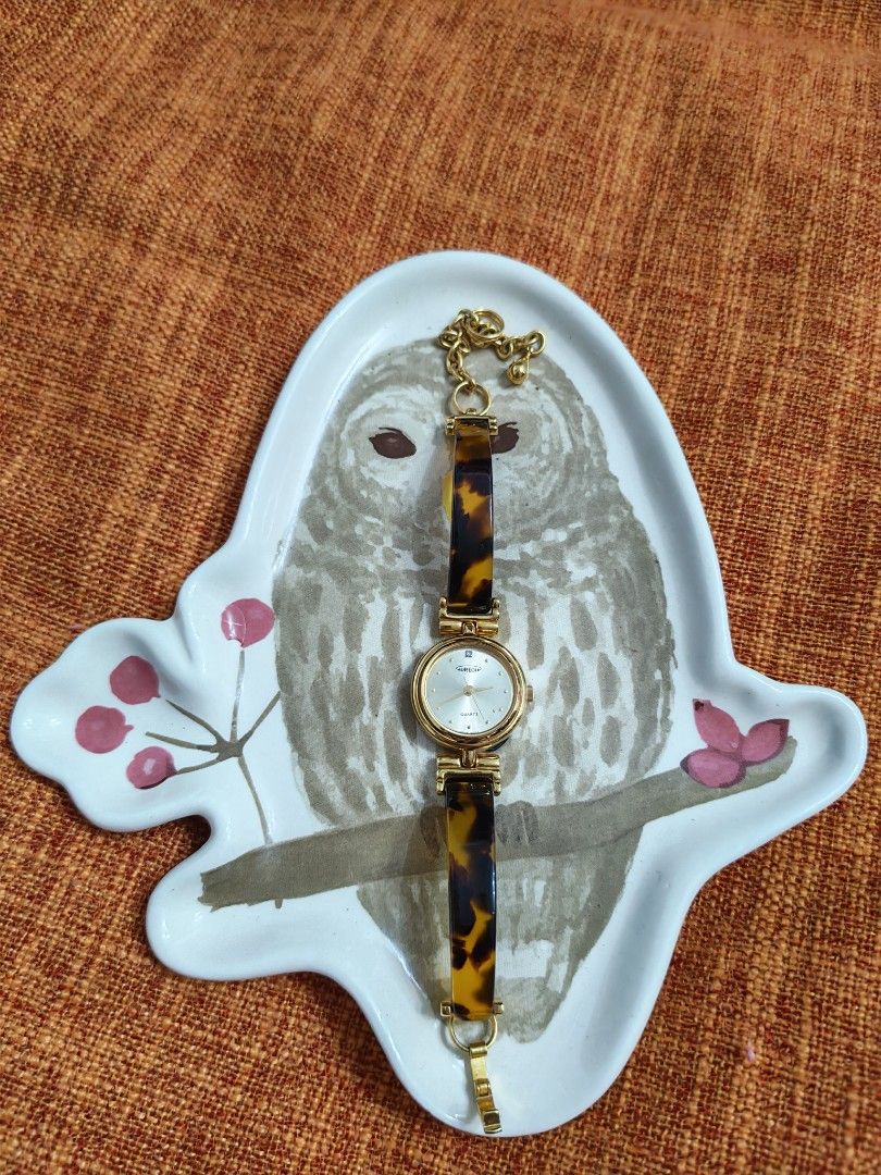 Vintage "Aureole" tortoiseshell-patterned gold-tone bangle Wristwatch (Category: Women's Watches) located in Trece Martires City. Submitted by heirloomhoursph (Listing ID 1467661060, Image 2). Description: ✨ Heirloom Hours – Available Piece ✨ Vintage "Aureole" tortoiseshell-patterned gold-tone bangle Wristwatch Php 3,999 + sf Details: ■ Brand/Series: Aureole ■ Model Number: SW-347/4D0866 ■ Movement: Quartz ■ Design Origin: Japan ■ Case Size: 22mm
