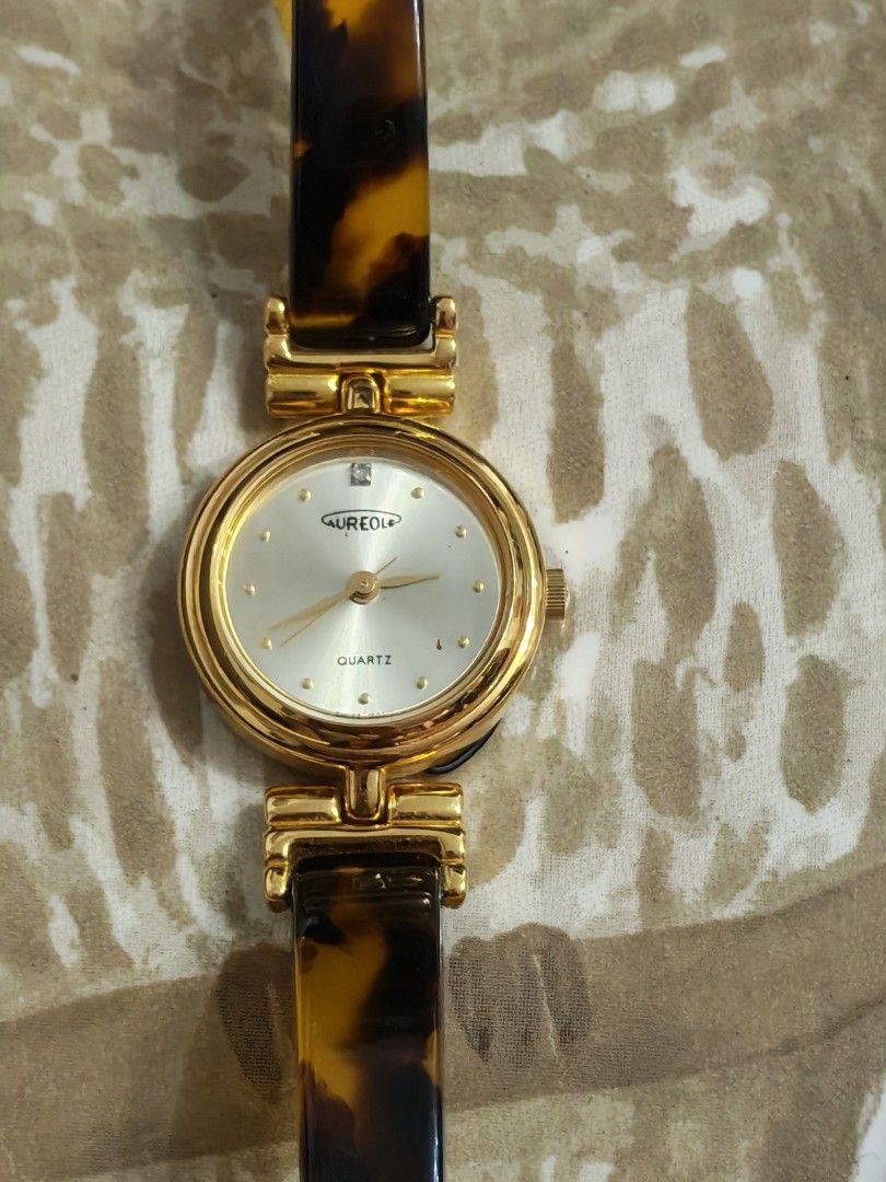 Vintage "Aureole" tortoiseshell-patterned gold-tone bangle Wristwatch (Category: Women's Watches) located in Trece Martires City. Submitted by heirloomhoursph (Listing ID 1467661060, Image 3). Description: ✨ Heirloom Hours – Available Piece ✨ Vintage "Aureole" tortoiseshell-patterned gold-tone bangle Wristwatch Php 3,999 + sf Details: ■ Brand/Series: Aureole ■ Model Number: SW-347/4D0866 ■ Movement: Quartz ■ Design Origin: Japan ■ Case Size: 22mm