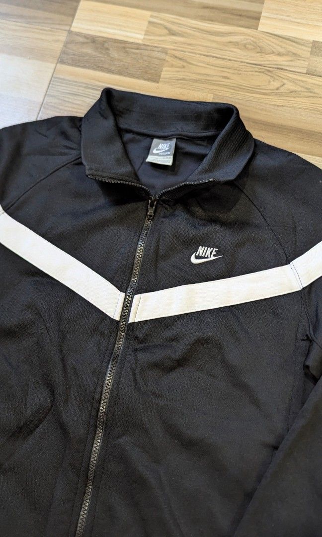 Vintage Black Nike Zip Up Track Jacket (Category: Coats, Jackets and Outerwear) located in Pasay City. Submitted by aatapparelshop (Listing ID 1467698315, Image 3). Description: Vintage Black Nike Zip Up Track Jacket good as new size large on tag dimes L26 w21 excellent condtion 1800 shipped.