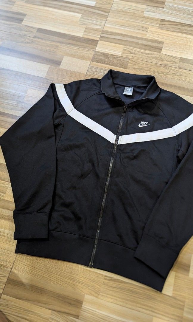 Vintage Black Nike Zip Up Track Jacket (Category: Coats, Jackets and Outerwear) located in Pasay City. Submitted by aatapparelshop (Listing ID 1467698315, Image 2). Description: Vintage Black Nike Zip Up Track Jacket good as new size large on tag dimes L26 w21 excellent condtion 1800 shipped.