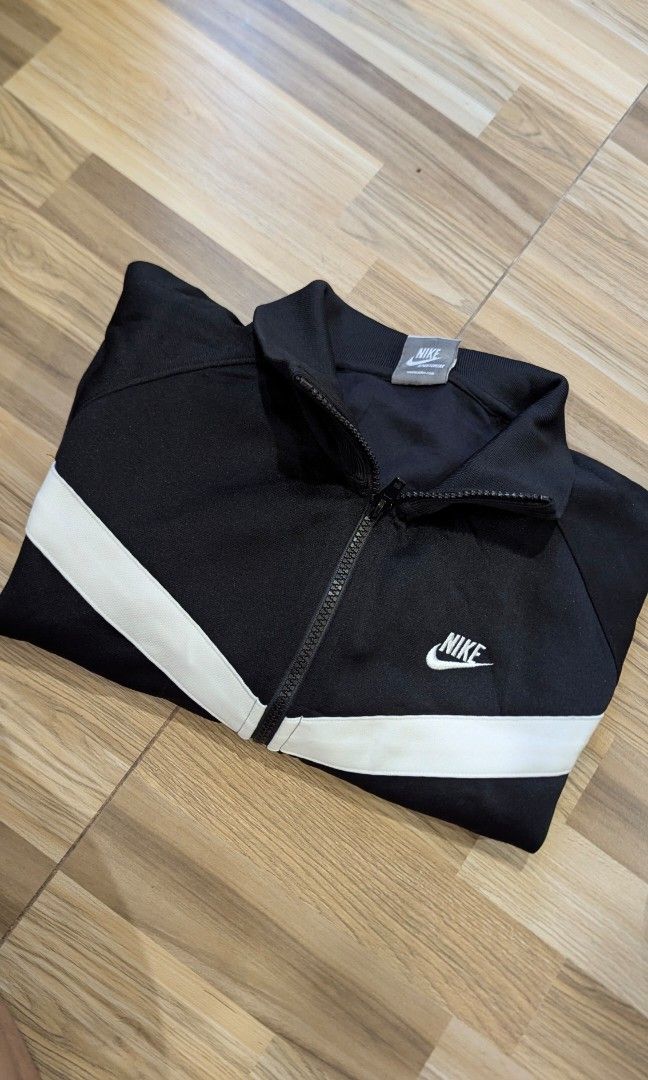 Vintage Black Nike Zip Up Track Jacket (Category: Coats, Jackets and Outerwear) located in Pasay City. Submitted by aatapparelshop (Listing ID 1467698315, Image 1). Description: Vintage Black Nike Zip Up Track Jacket good as new size large on tag dimes L26 w21 excellent condtion 1800 shipped.