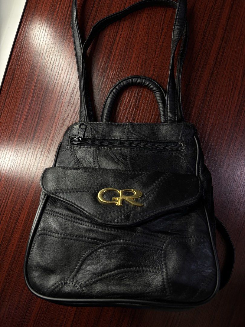 Vintage Black Shoulder Bag (Category: Luxury Bags & Wallets) located in Manila. Submitted by prlovedstff (Listing ID 1467817938, Image 2). Description: Preloved black shoulder bag with gold-tone logo detail and multiple compartments. Classic vintage-inspired style, perfect for everyday use and Y2K outfits. Condition: Preloved, with visible signs of use and creasing. Please check photos for actual condition..