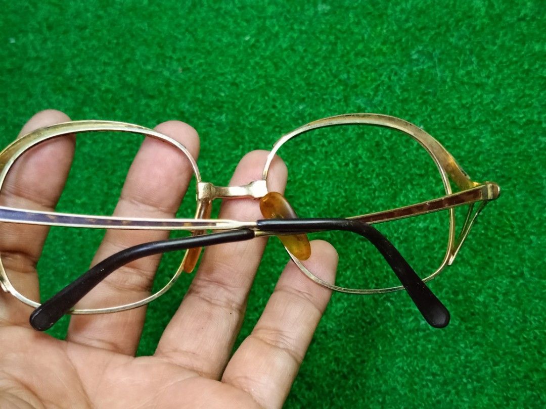 Vintage Christian Dior Eyeglass Frames Gold CD Logo (Category: Sunglasses & Eyewear) located in Bacoor. Submitted by bibelot03 (Listing ID 1467761370, Image 3). Description: - Gold-tone/Gold Plated metal frames with tortoiseshell nose pads and temple tips - Classic double bridge architecture - Distinctive CD logo badge on temple hinges - Sleek black temple arms - Rx-ready: suitable for prescription or tinted lenses.