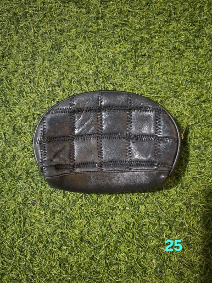Vintage dark brown patch leather pouch cosmetic bag (Category: Purses & Pouches) located in Pasay City. Submitted by emilia1102 (Listing ID 1467801568, Image 1). Description: - Color: Dark brown - Material: Soft textured leather - Design: Stylish patchwork with visible zigzag stitching - Closure: Secure zippered top with a curved shape - Size: Compact, ideal for daily essentials or makeup.