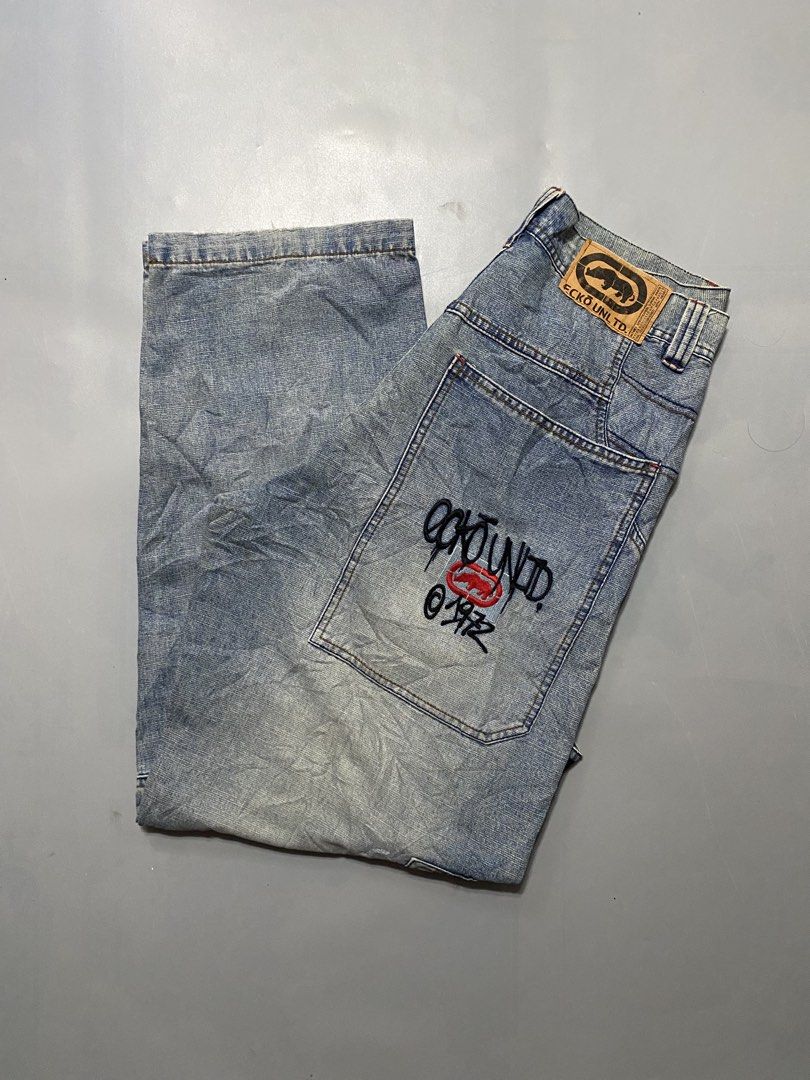 Vintage Ecko Unld. Denim Cargo Jeans Light Wash (Category: Jeans) located in Manila. Submitted by delunakenn94368 (Listing ID 1467757382, Image 3). Description: 32 x 41 x 9 - Brand: Ecko Unltd (Classic 1972 Streetwear) - Style: Light wash denim cargo jeans with a relaxed fit - Details: Signature rhino leather patch on back waistband and large embroidered graffiti logo on back pocket - Functionality: Multiple utility pockets and side hammer loop -