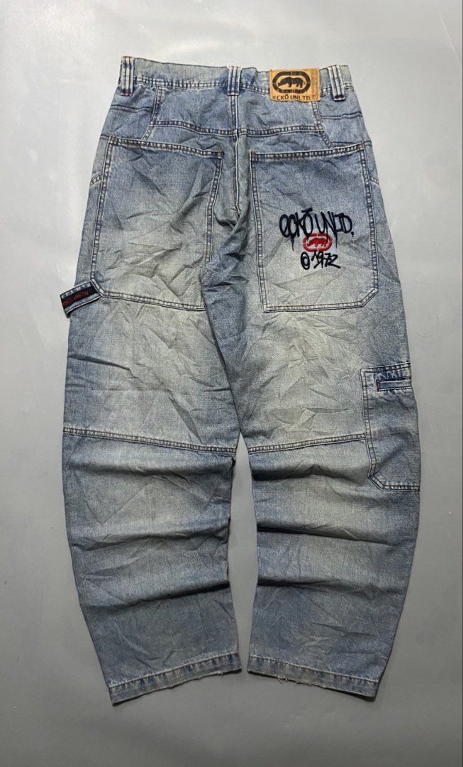 Vintage Ecko Unld. Denim Cargo Jeans Light Wash (Category: Jeans) located in Manila. Submitted by delunakenn94368 (Listing ID 1467757382, Image 1). Description: 32 x 41 x 9 - Brand: Ecko Unltd (Classic 1972 Streetwear) - Style: Light wash denim cargo jeans with a relaxed fit - Details: Signature rhino leather patch on back waistband and large embroidered graffiti logo on back pocket - Functionality: Multiple utility pockets and side hammer loop -