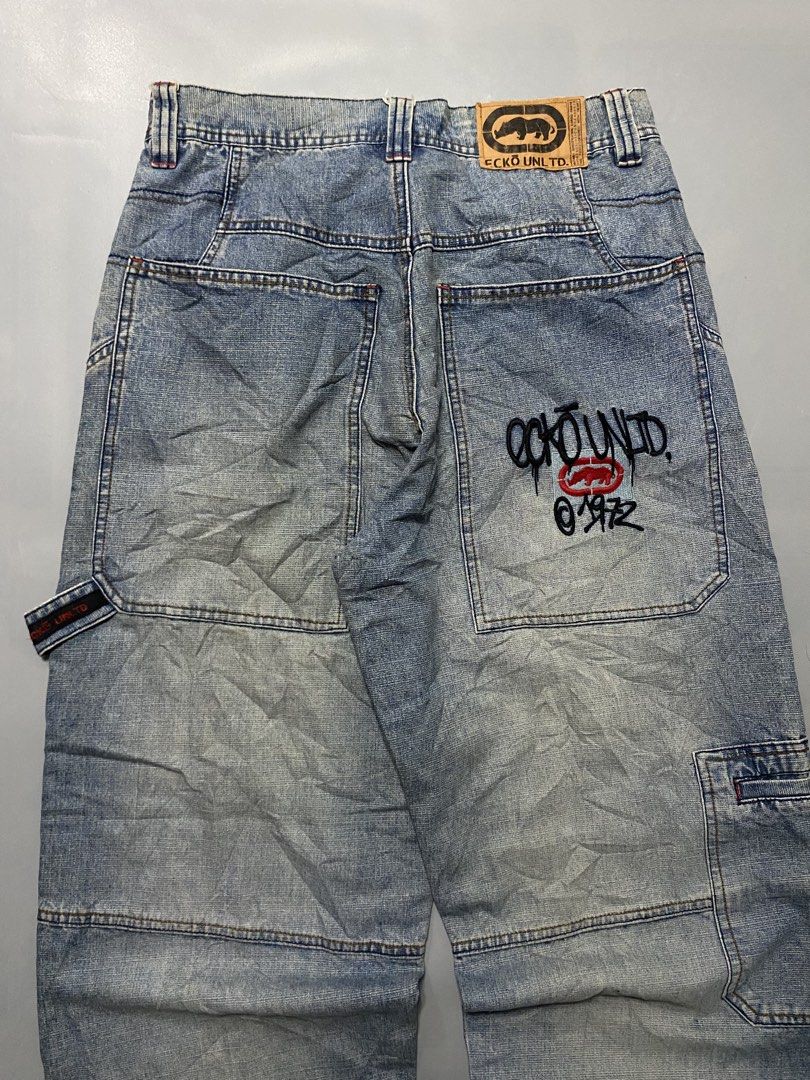 Vintage Ecko Unld. Denim Cargo Jeans Light Wash (Category: Jeans) located in Manila. Submitted by delunakenn94368 (Listing ID 1467757382, Image 2). Description: 32 x 41 x 9 - Brand: Ecko Unltd (Classic 1972 Streetwear) - Style: Light wash denim cargo jeans with a relaxed fit - Details: Signature rhino leather patch on back waistband and large embroidered graffiti logo on back pocket - Functionality: Multiple utility pockets and side hammer loop -
