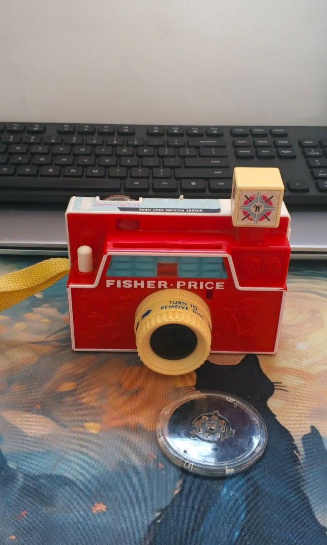 Vintage Fisher Price Camera (Category: Educational & Learning Toys) located in San Jose del Monte. Submitted by cjheii (Listing ID 1467702313, Image 1). Description: Vintage Fisher Price Changeable Picture Disc Camera Mattel Markings With 1 disc only Has sticker and paint chips Sold as is Let go collection; need fund 800 pesos Loc: SJDM Bulacan Courier: Flash For more toys, please LIKE our FB page CJ Doll & Toy Hunter Thank you and God bless.