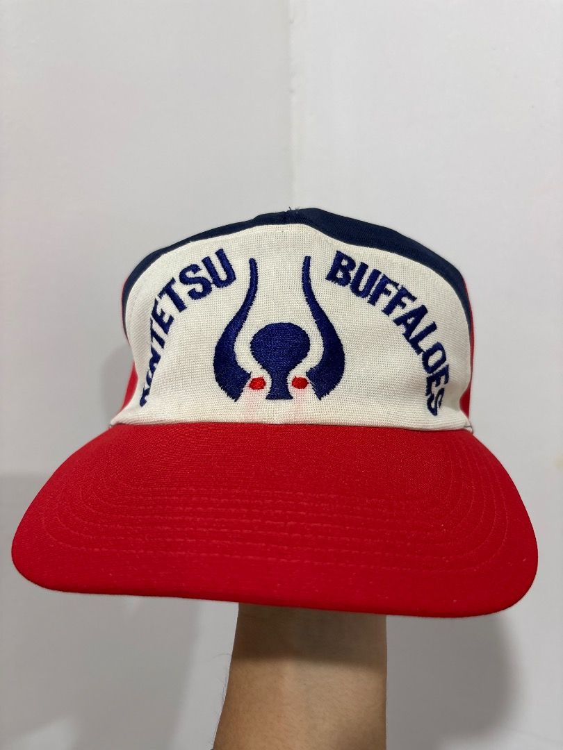 Vintage Kintetsu Buffaloes Baseball Cap (Category: Caps & Hats) located in Marikina City. Submitted by zaxcheus_castillo1708 (Listing ID 1467625129, Image 1). Description: - Vintage Kintetsu Buffaloes team snapback cap - White front panel with classic blue embroidery and red buffalo horns logo - Contrast red brim and navy top accent - Adjustable snapback fit for all head sizes - Ideal for baseball memorabilia collectors and vintage streetwear ent