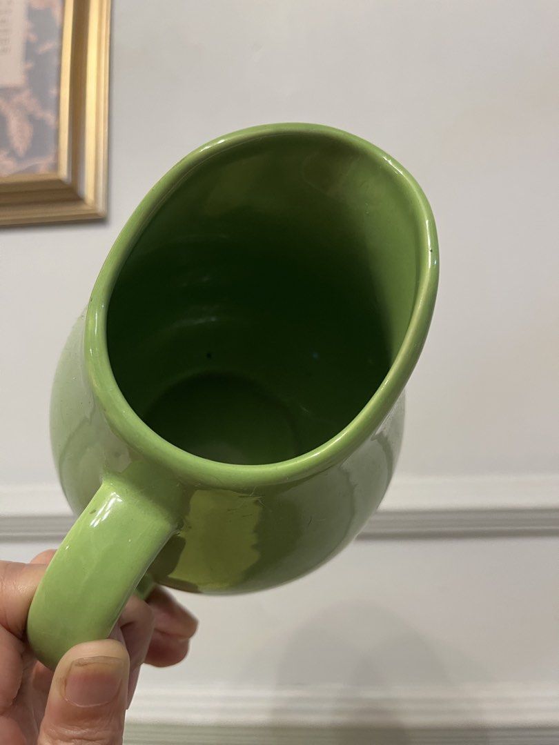 Vintage lime-green or chartreuse ceramic creamer pitcher (Category: Pitchers & Dispensers) located in Quezon City. Submitted by metamerchant (Listing ID 1467740018, Image 2). Description: - Vibrant bright green ceramic pitcher with a glossy glaze finish - Features a sturdy handle and wide pouring spout for easy serving - Stable round flat base with a clean interior - Versatile everyday piece ideal for water, juice, or table flowers - Condition: B