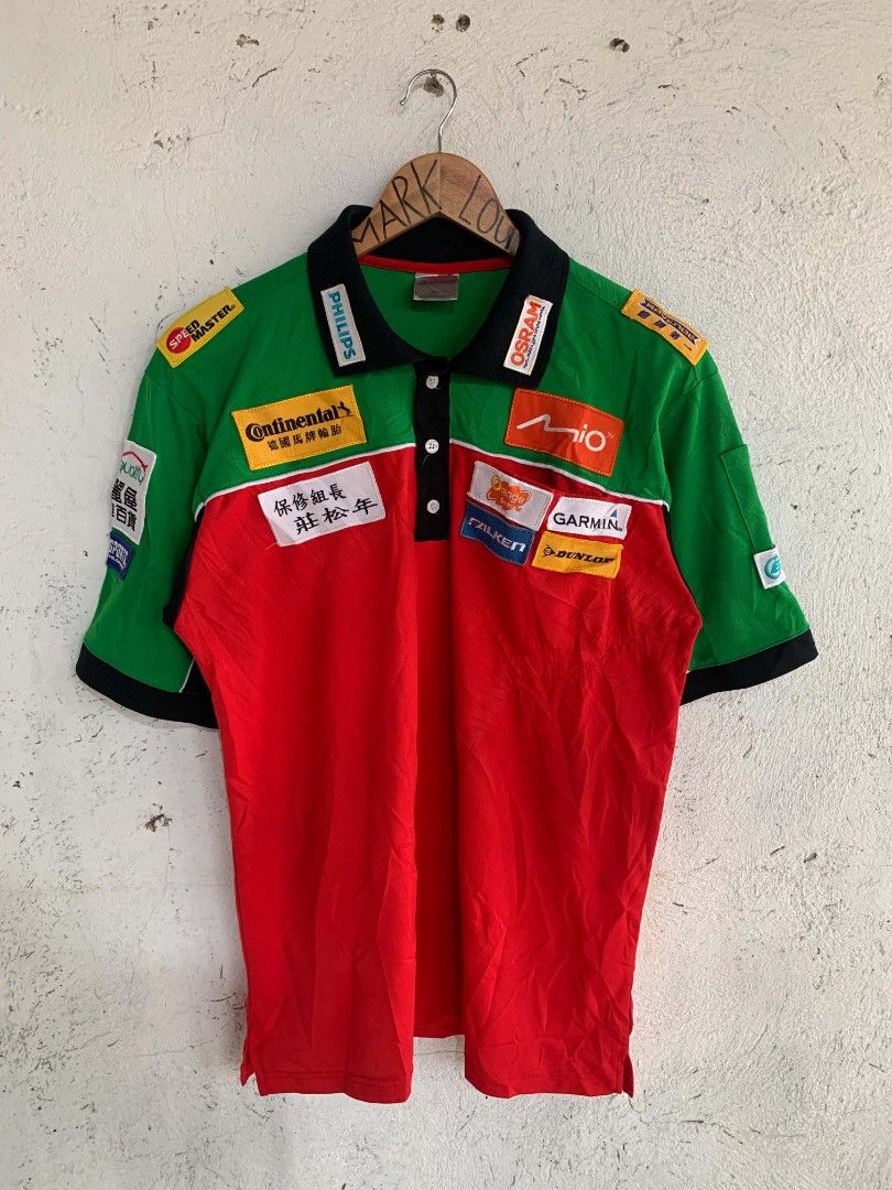 Vintage Racing Style Patchwork Polo Shirt (Category: Tshirts & Polo Shirts ) located in Manila. Submitted by louiseluch69680 (Listing ID 1467649217, Image 1). Description: - Style: Racing style streetwear polo shirt - Colors: Green, red, and black color blocking - Details: Embroidered sponsor patches and Chinese character prints on back and chest - Features: Button placket and classic collar - Size: XL (dimes 21.5x28.5) - condition: excellent, is