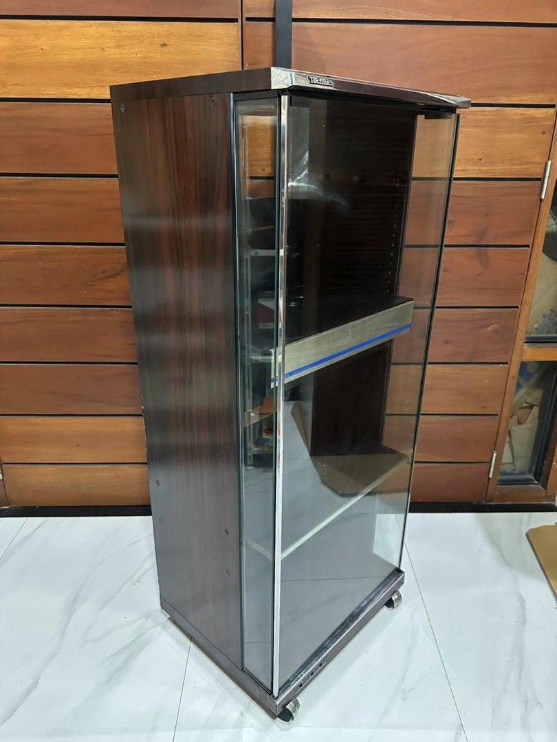 Vintage Rare Technics SH-615 Tower Audio Rack (Category: Other Audio Equipment) located in Quezon City. Submitted by dannikkishoppe2 (Listing ID 1467641461, Image 2). Description: Vintage Rare Technics SH-615 Tower Audio Rack ‼️₱6500‼️ *for component stereo equipments *glass front door *cassette storage rack *built-in caster wheels *with headphone and microphone jacks *good condition W19.5in x D16in x H47.5in Please manage your expectations as th