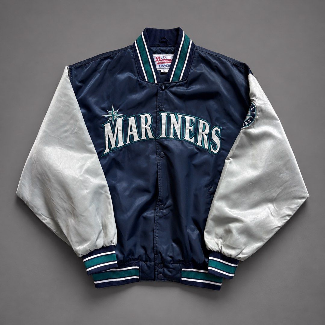 VINTAGE SEATTLE MARINERS DIAMOND COLLECTION STARTER SATIN BOMBER JACKET (Category: Coats, Jackets and Outerwear) located in Taguig. Submitted by clarrk95 (Listing ID 1467637353, Image 1). Description: Vintage Seattle Mariners Diamond Collection Starter Satin Bomber Jacket Date: 1990's Size: XL (tag) Length: 28inches Width: 27inches Sleeve: 19inches PRICE: ₱2,000 ONLY! FLAW/S: stain | inner layer damage | inner pocket ✅ very good condition ✅ add s