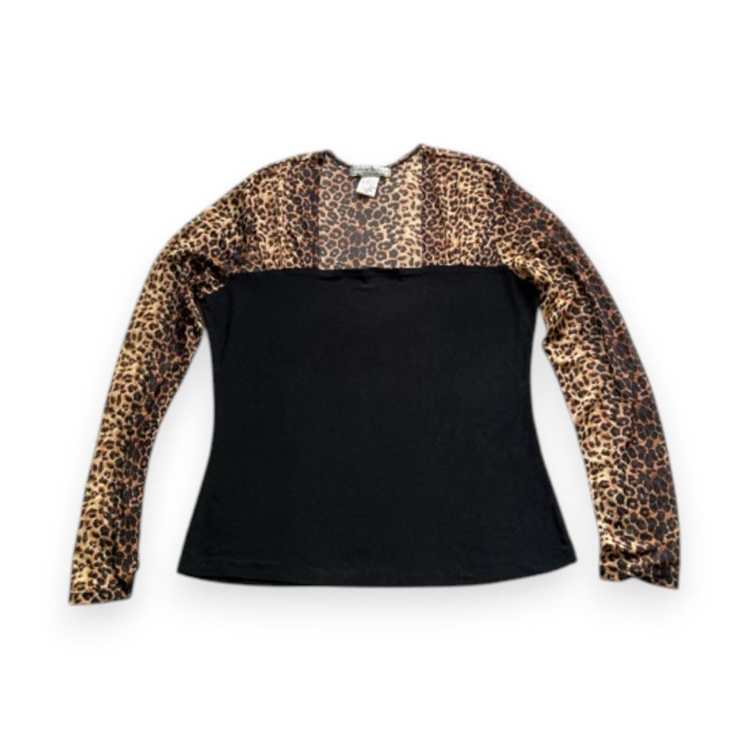 Vintage Suzie Leopard Print Black Top (Category: Longsleeves) located in Rizal. Submitted by sheeraay (Listing ID 1467661898, Image 1). Description: - Brand: Vintage Suzie - Size: M (tag attached) - Design: Leopard print sheer top with a solid black bottom section - Neckline: Scoop neck - Material: Soft and stretchy black fabric.