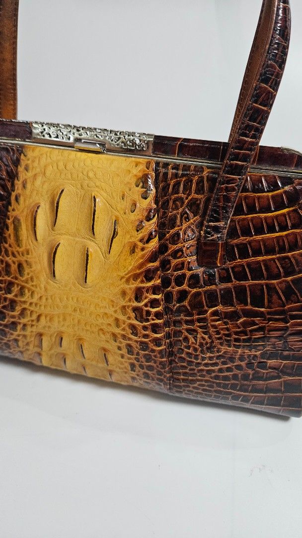 Vintage Two-Tone Crocodile Pattern Handbag Kisslock Closure (Category: Luxury Bags & Wallets) located in Alfonso. Submitted by jbcamet (Listing ID 1467710296, Image 2). Description: - Eye-catching two-tone brown and yellow crocodile texture - Classic structured frame with a secure silver kisslock closure - Comfortable dual shoulder straps for easy carrying - Clean brown fabric-lined interior with a back-wall zipper pocket - Firm structure with ne
