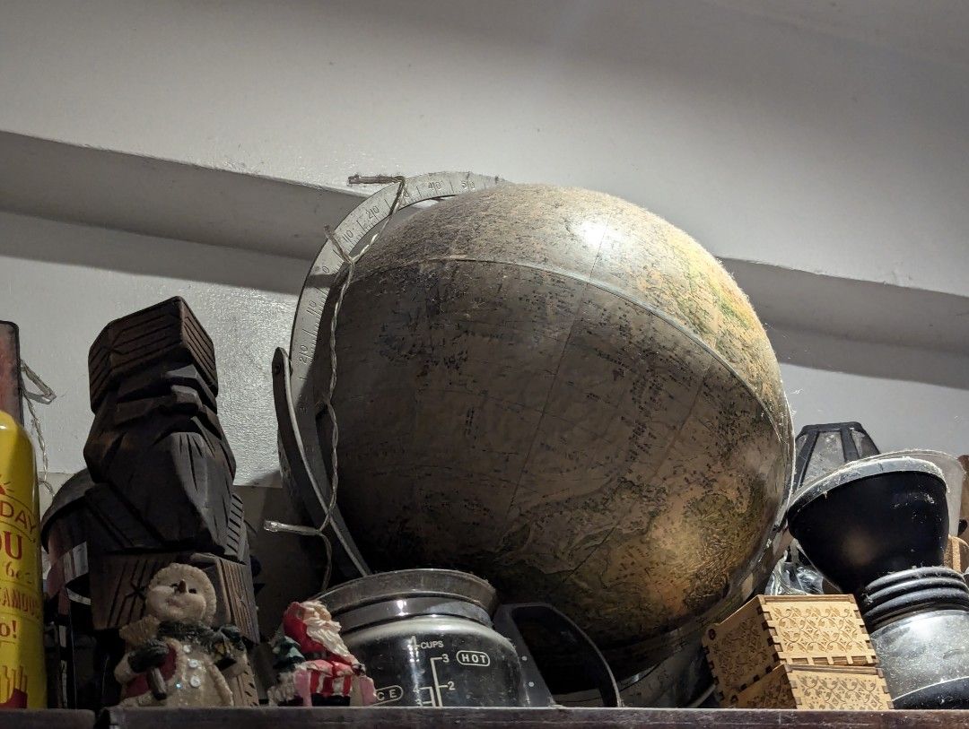 Vintage World Globe with Stand (Category: Vintage Collectibles) located in Pasig City. Submitted by imperiumhk (Listing ID 1467687198, Image 3). Description: mix display items, from old display cabinet. needs cleaning. 1.Vintage World globe (p2,000.00) with detailed earth map and country boundaries ( japanese print )Supported by a sturdy metal meridian ring and stand - Adds a classic, scholarly touch to shelves or study desks - Shows minor dust f