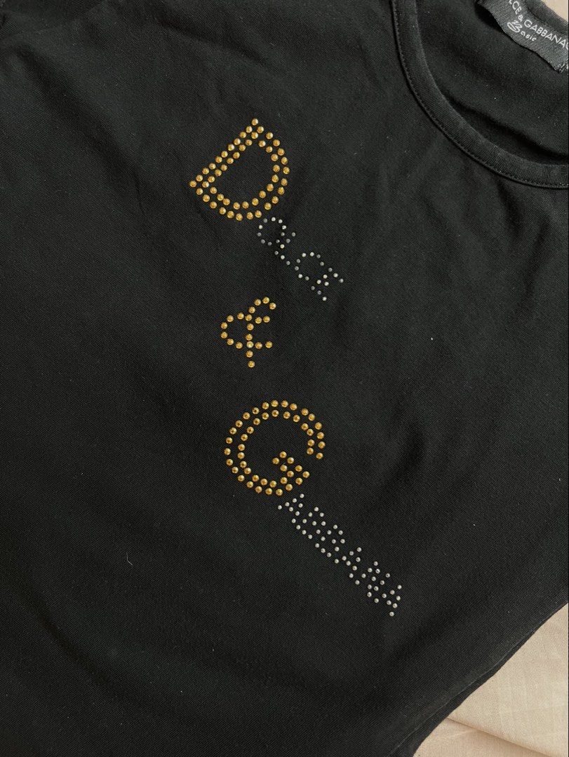 vintage y2k dolce and gabbanna basic tshirt (Category: Shirts) located in Pasig City. Submitted by svgarr (Listing ID 1467664361, Image 2). Description: read bio and caption before buying to save us both time!! fits xs-small some rhinestones have lost their shine and appear dull or discolored, but it’s not very noticeable (see last pic for flaw) 📍iloilo shipping via courier of your choice, sf c/o buyer .