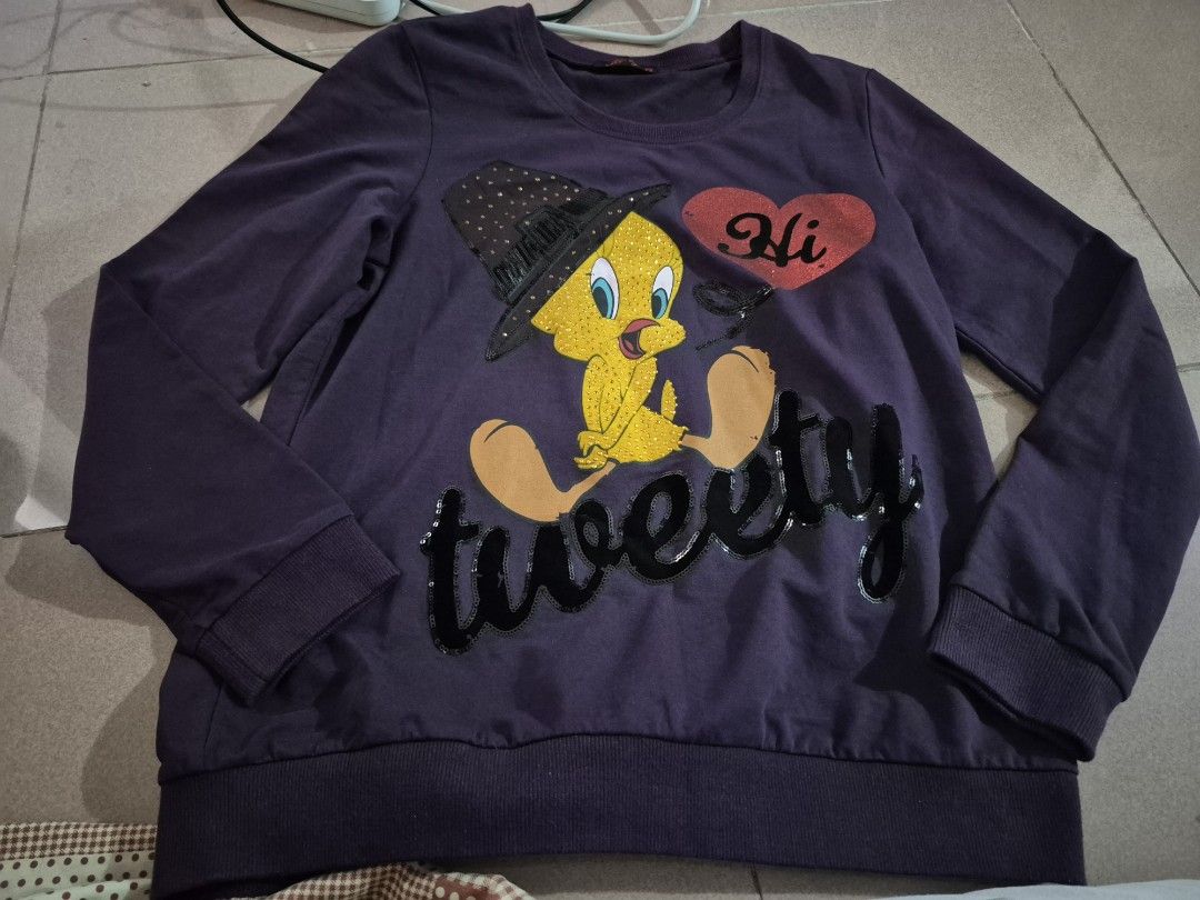 Violet Tweety Bird Sweater (Category: Longsleeves) located in Calamba. Submitted by bb.lace (Listing ID 1467610538, Image 1). Description: no issue 19 bust width 25.5 length.
