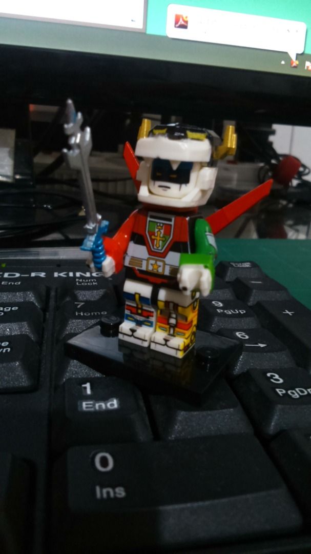 Voltron custom building block minifigure with sword (Category: Lego & Building Sets) located in Quezon City. Submitted by susmaryosep1 (Listing ID 1467711937, Image 2). Description: - Custom Voltron-styled minifigure - Fully printed torso, legs, and custom helmet - Includes a silver sword accessory - Comes with a black display base for secure standing - Perfect for fans of the classic robot series 400.