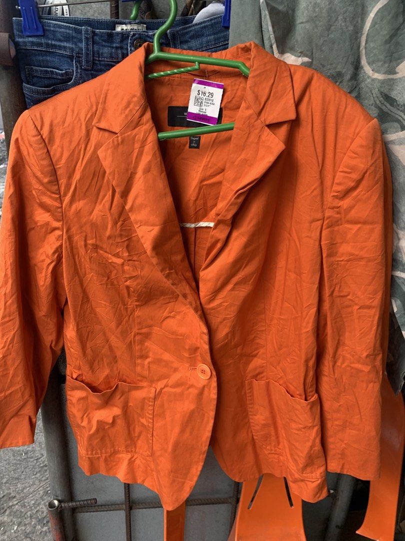 Weekend Max Mara Orange Blazer (Category: Coats, Jackets and Outerwear) located in Manila. Submitted by spaceshop12345 (Listing ID 1467690440, Image 2). Description: - Brand: Weekend Max Mara - Size: S - Color: Bright Orange - Closure: Single button front - Pockets: Two patch pockets near the hem - Collar: Lapel neckline - Style: Bold statement piece, perfect for layering.