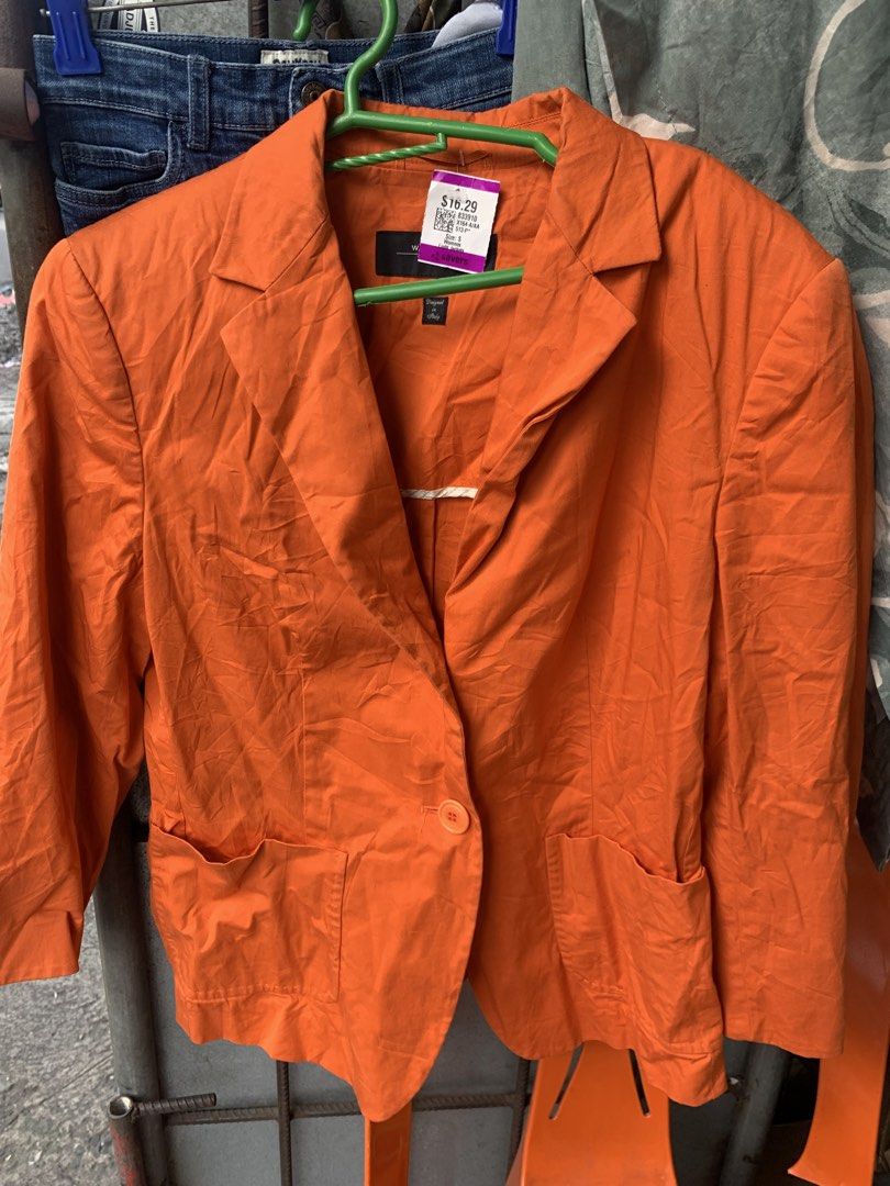 Weekend Max Mara Orange Blazer (Category: Coats, Jackets and Outerwear) located in Manila. Submitted by spaceshop12345 (Listing ID 1467690440, Image 1). Description: - Brand: Weekend Max Mara - Size: S - Color: Bright Orange - Closure: Single button front - Pockets: Two patch pockets near the hem - Collar: Lapel neckline - Style: Bold statement piece, perfect for layering.