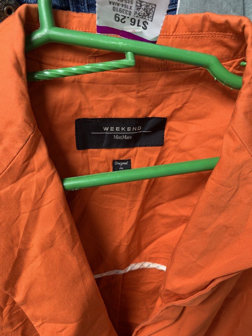 Weekend Max Mara Orange Blazer (Category: Coats, Jackets and Outerwear) located in Manila. Submitted by spaceshop12345 (Listing ID 1467690440, Image 3). Description: - Brand: Weekend Max Mara - Size: S - Color: Bright Orange - Closure: Single button front - Pockets: Two patch pockets near the hem - Collar: Lapel neckline - Style: Bold statement piece, perfect for layering.