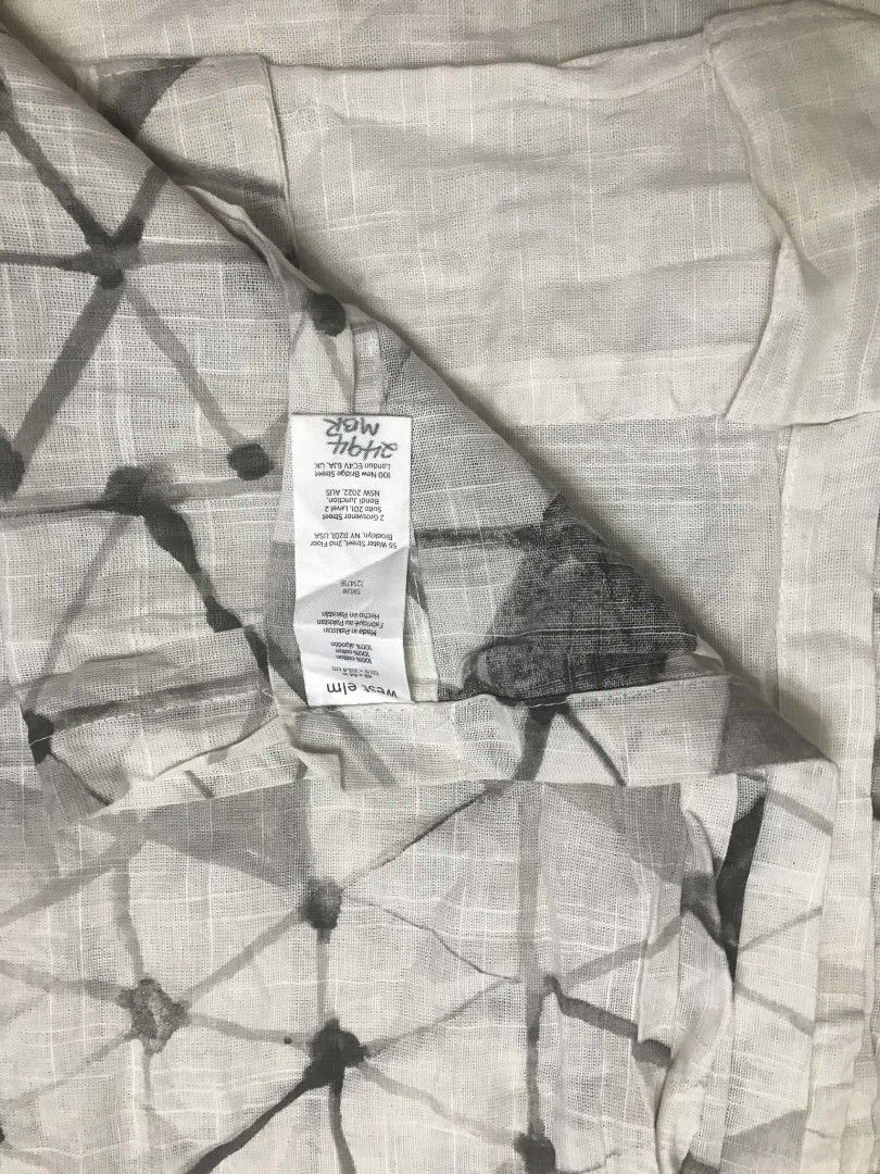 West Elm geometric print cotton curtain 1 panel (Category: Curtains & Blinds) located in Imus. Submitted by stop_shop7 (Listing ID 1467624342, Image 1). Description: - Brand: West Elm - Design: White fabric with grey geometric triangle pattern - Material: 100% cotton with a nice textured gauze feel - Size: 48 x 84 inches - Origin: Made in Pakistan .