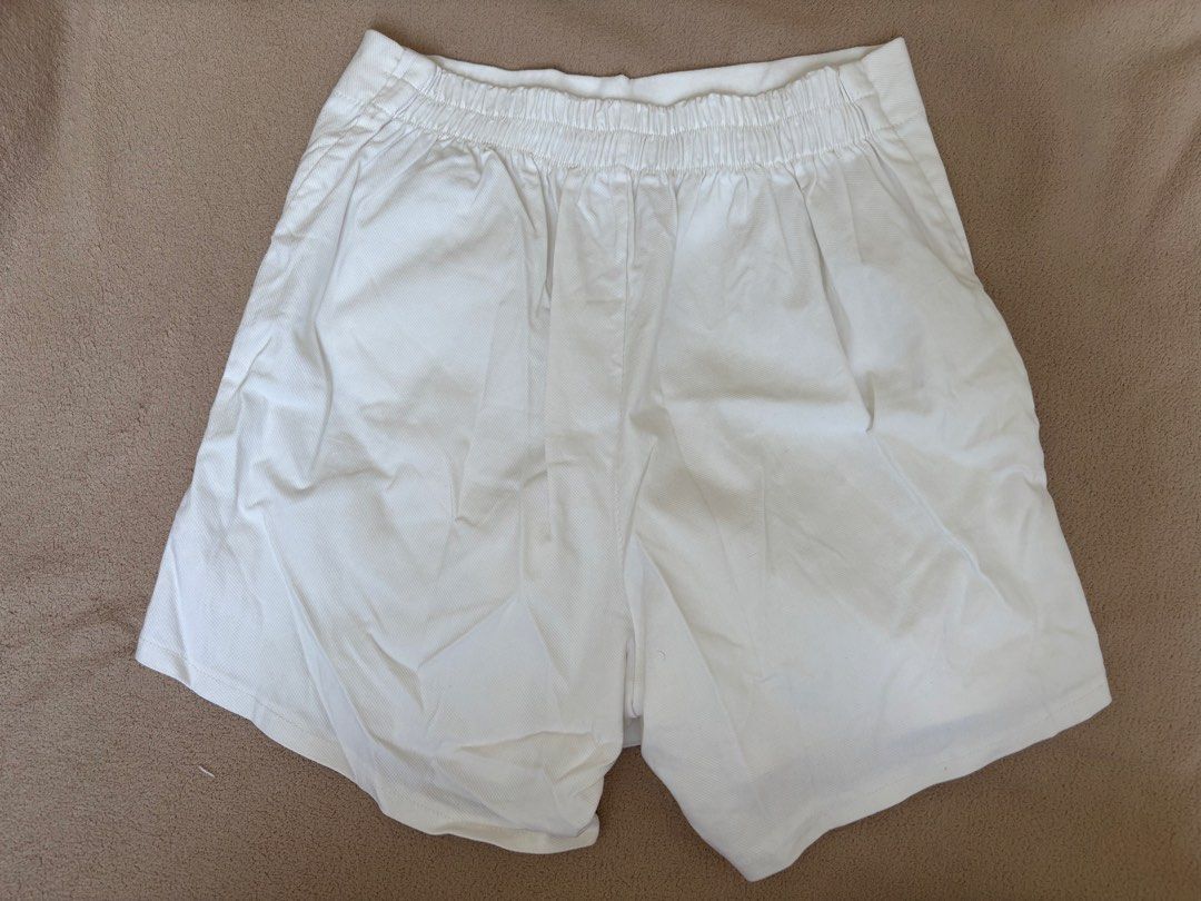 White asymmetrical wrap-style mini short (Category: Shorts) located in Pasig City. Submitted by llovedbyliv (Listing ID 1467632866, Image 3). Description: Waist - 25-28in (stretchable) Length - 13in No issues.