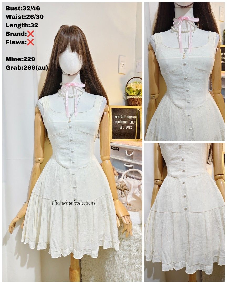 White Corset Style Mini Dress (Category: Dresses) located in Manila. Submitted by chynii_28 (Listing ID 1467624811, Image 1). Description: - Style: White sleeveless mini dress with button-up front detailing - Neckline & Fit: Square neckline and fitted bodice with a flared tiered skirt - Fabric: Lightweight, textured fabric with subtle vertical stripes - Measurements: Bust 32/46", Waist 26/30", Length 32" - Perfect for: Sunny days, casual hangouts