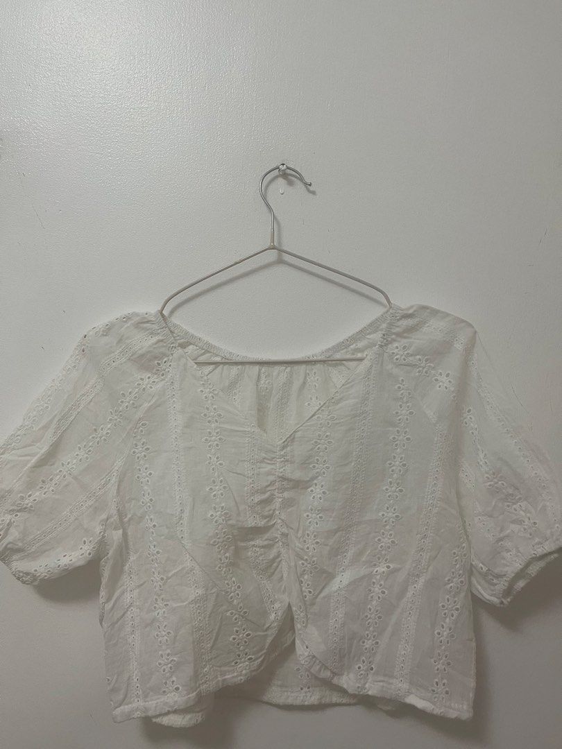 White Eyelet Embroidered Crop Top Blouse (Category: Blouses) located in Batangas. Submitted by povofkbscloset (Listing ID 1467670163, Image 1). Description: - Color: White - Style: Short-sleeve crop top with V-neck and ruched front - Details: Allover eyelet embroidery, floral patterns, and trendy puff sleeves - Fabric: Light, airy, and breathable for warm weather - Condition: Brand new/Excellent - Perfect for: Casual lakad, beach trips, or OOTDs.