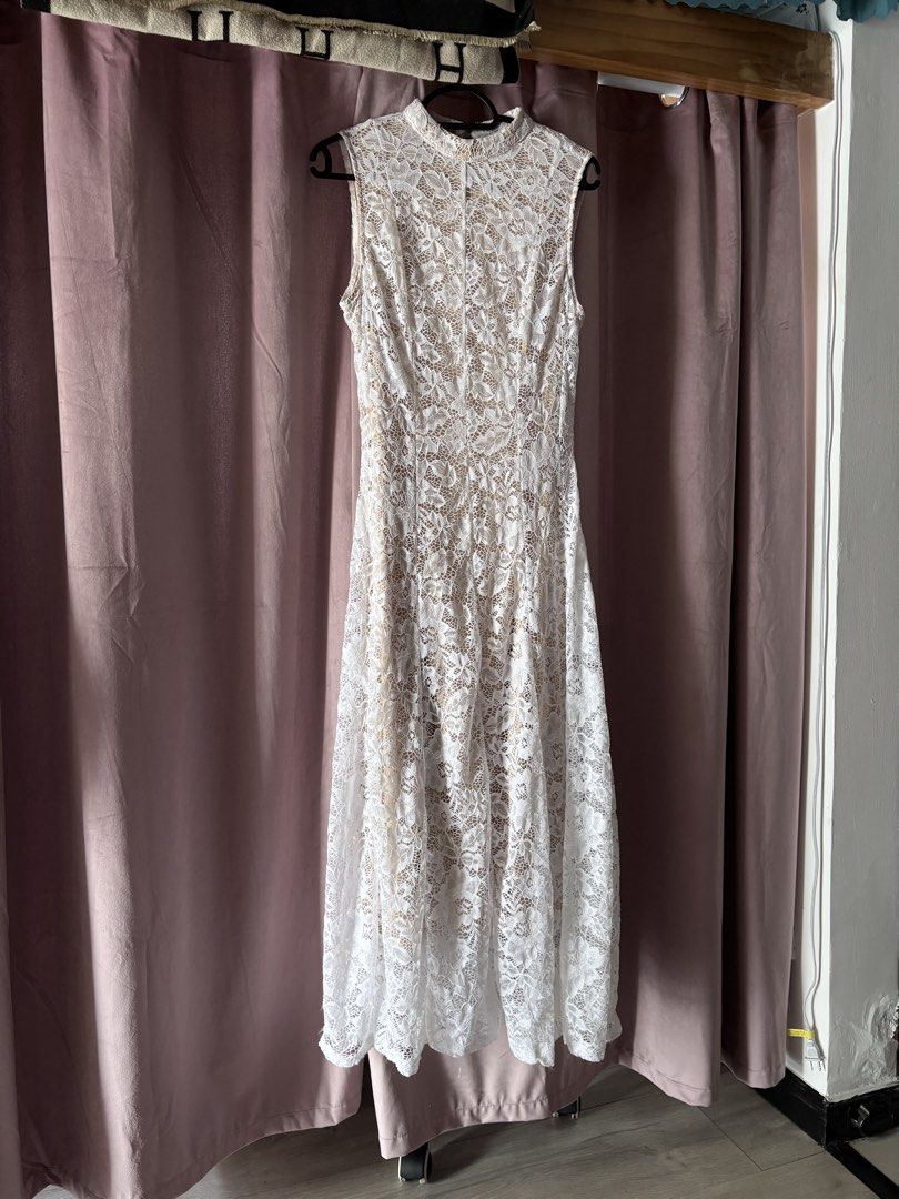 White lace long dress with nude lining (Category: Dresses) located in Manila. Submitted by hannieu (Listing ID 1467777928, Image 1). Description: White floral lace midi dress over a nude slip lining. Sleeveless design with a high mock neckline and a keyhole cutout detail at the back. Midi length with a fitted bodice and flared skirt. Great piece for weddings, dates, or brunch outings..