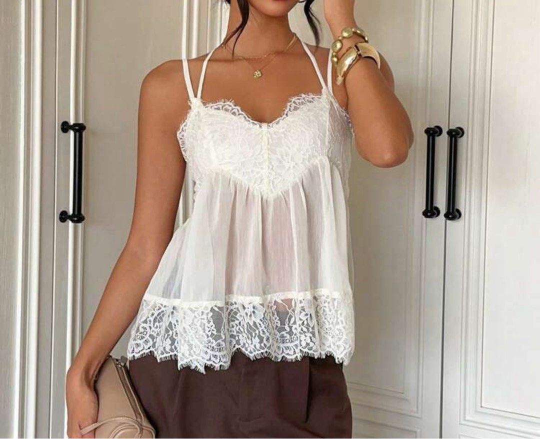 White Lace Trim Halter Cami Top (Category: Sleeveless) located in Quezon City. Submitted by samxg (Listing ID 1467772719, Image 3). Description: Used once! Adjustable straps + tie halter. Very flowy! Ww already posted..