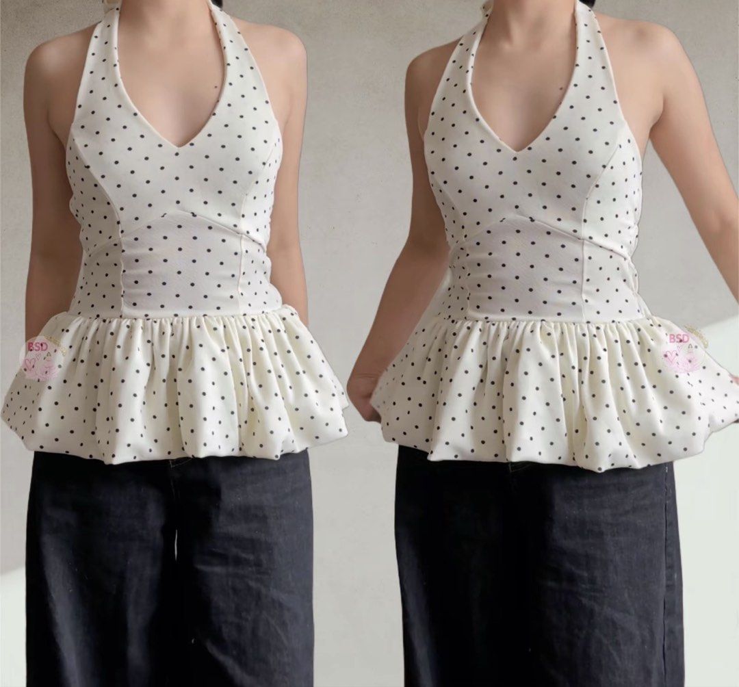White Polka Dot Halter Peplum Top (Category: Sleeveless) located in Quezon City. Submitted by kaye1001 (Listing ID 1467731206, Image 1). Description: Small but can fit medium (stretchable & self tie halter top) Worn twice only RFS- decluttering - Color & Pattern: White with all-over black polka dots - Design: Fitted bodice with a flared peplum hem and deep V-neckline - Styling: Pairs effortlessly with dark jeans or trousers - Occasion: Perfect fo
