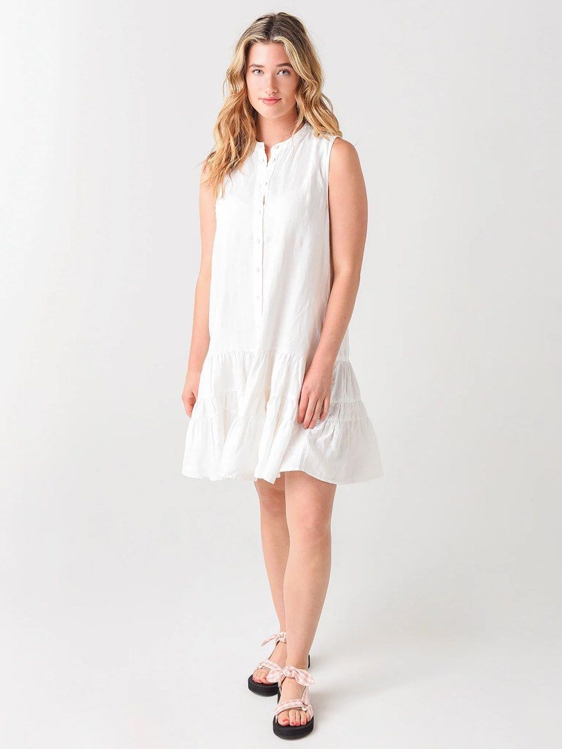 White sleeveless flounce mini dress with a front button placket (Category: Dresses) located in Cordova. Submitted by thedecluterrer (Listing ID 1467606499, Image 1). Description: .