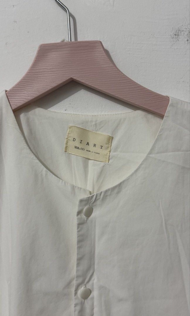White sleeveless flounce mini dress with a front button placket (Category: Dresses) located in Cordova. Submitted by thedecluterrer (Listing ID 1467606499, Image 3). Description: .
