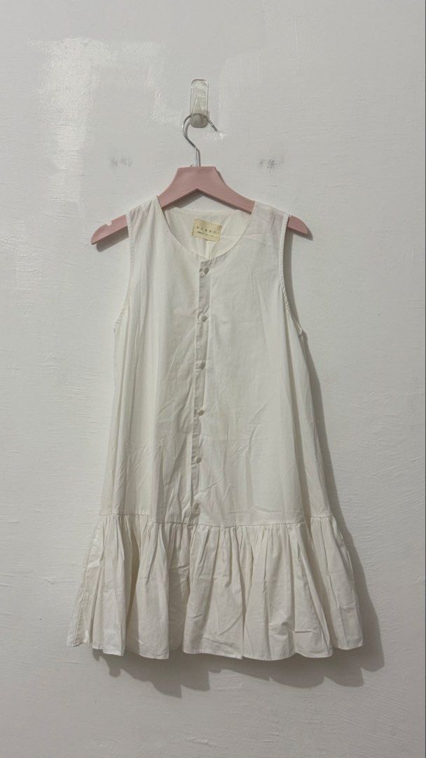 White sleeveless flounce mini dress with a front button placket (Category: Dresses) located in Cordova. Submitted by thedecluterrer (Listing ID 1467606499, Image 2). Description: .