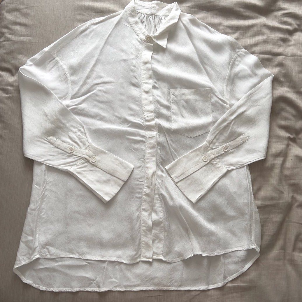 White Textured Button-Down Oversized Long Sleeve Shirt (Category: Longsleeves) located in Pasig City. Submitted by jenscloset86 (Listing ID 1467645701, Image 1). Description: Color: Classic White Fit: Oversized and relaxed • Unique collar (see photo) • Lightweight fabric, breathable material with subtle texture. • Thrifted. • No damage, no flaws. Measurement (in inches): Length: 29” Bust: 46” Shoulder: 22” Sleeve: 21.5”.