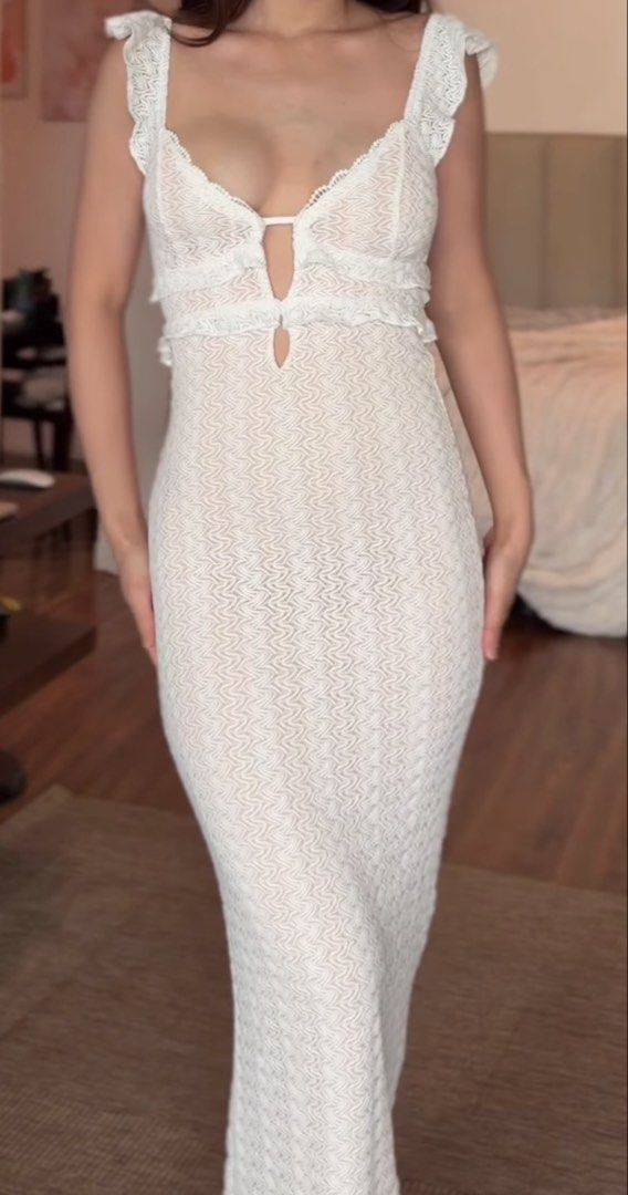 White textured maxi dress with ruffled straps (Category: Dresses) located in Makati City. Submitted by prelovedloot (Listing ID 1467739404, Image 1). Description: - Color: White - Style: Sleeveless maxi dress with form-fitting silhouette to the floor - Details: Textured patterned fabric, ruffled shoulder straps, deep V-neckline with front cutout accents - Condition: Worn once for a quick photo, stored properly since then - Best for: Warm weather,