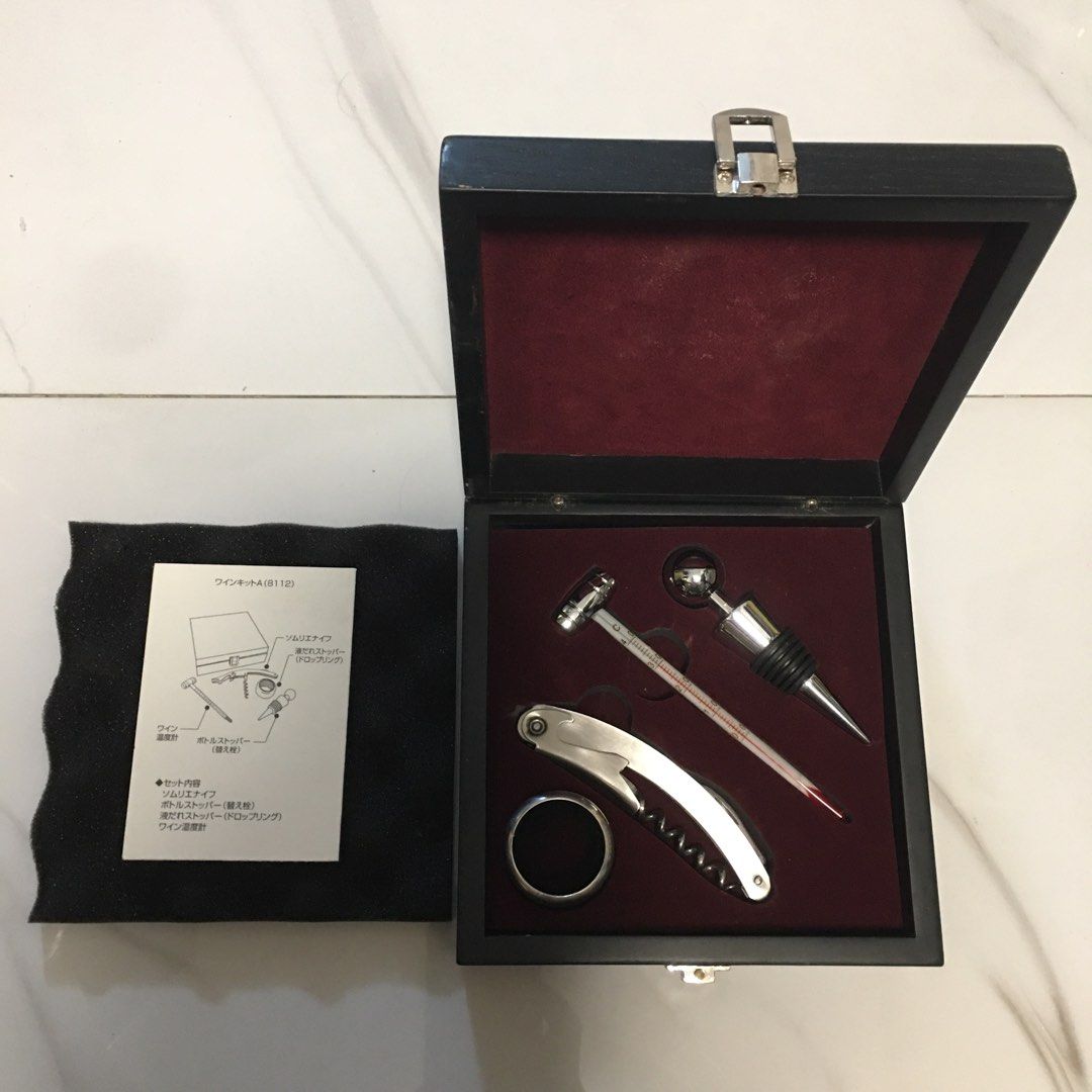 Wine Kit A B112 Wine Accessory Gift Box (Category: Wine Cellar & Storage) located in Pasay City. Submitted by gilbertso62551 (Listing ID 1467682662, Image 1). Description: - Elegant wine tool set housed in a stylish black wooden storage box with luxurious maroon velvet lining - Includes all essential accessories: waiter's friend corkscrew with foil cutter, rubber-sealed bottle stopper, felt-lined drip stop ring, and a barrel-topped wine thermomet