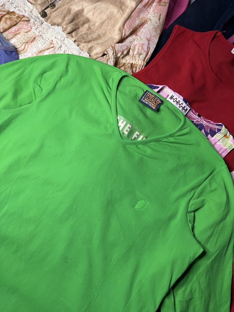 W&LT Wild and Lethal Trash Green Top (Category: Shirts) located in Catbalogan. Submitted by yellfindss (Listing ID 1467812057, Image 2). Description: - Brand: W&LT Wild and Lethal Trash (Made in Italy) - Color: Bright green - Style: 3/4 sleeve, V-neck, comfortable cotton fit - Details: 'Kiss The Future' debossed graphic on the back, chest lettering - Accent: Small embroidered lightning bolt logo on the front.