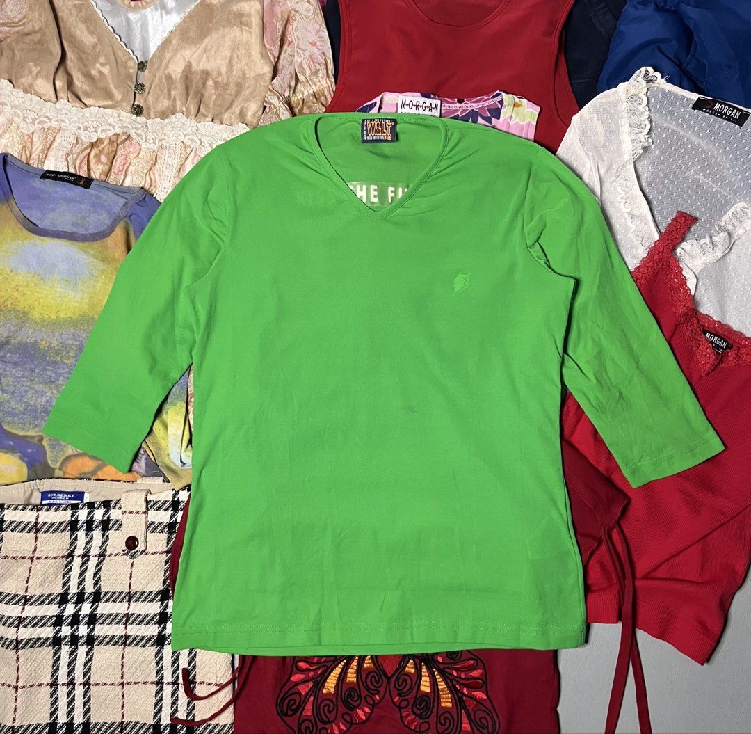W&LT Wild and Lethal Trash Green Top (Category: Shirts) located in Catbalogan. Submitted by yellfindss (Listing ID 1467812057, Image 1). Description: - Brand: W&LT Wild and Lethal Trash (Made in Italy) - Color: Bright green - Style: 3/4 sleeve, V-neck, comfortable cotton fit - Details: 'Kiss The Future' debossed graphic on the back, chest lettering - Accent: Small embroidered lightning bolt logo on the front.