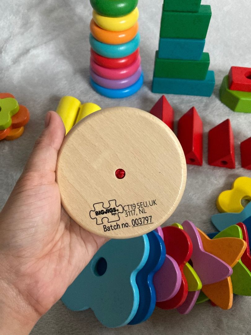 Wooden Stacking and Sorting Set Toys (Category: Educational & Learning Toys) located in Rizal. Submitted by sheeraay (Listing ID 1467702060, Image 3). Description: - Brand: Bigjigs - Material: Solid wood - Includes: Stacking flowers, classic ring stacker, building blocks, cylinders, and geometric shapes - Colors: Bright primary and pastel shades - Condition: Clean, sanitized, and ready for a new home - Ideal for: Toddler learning and development.