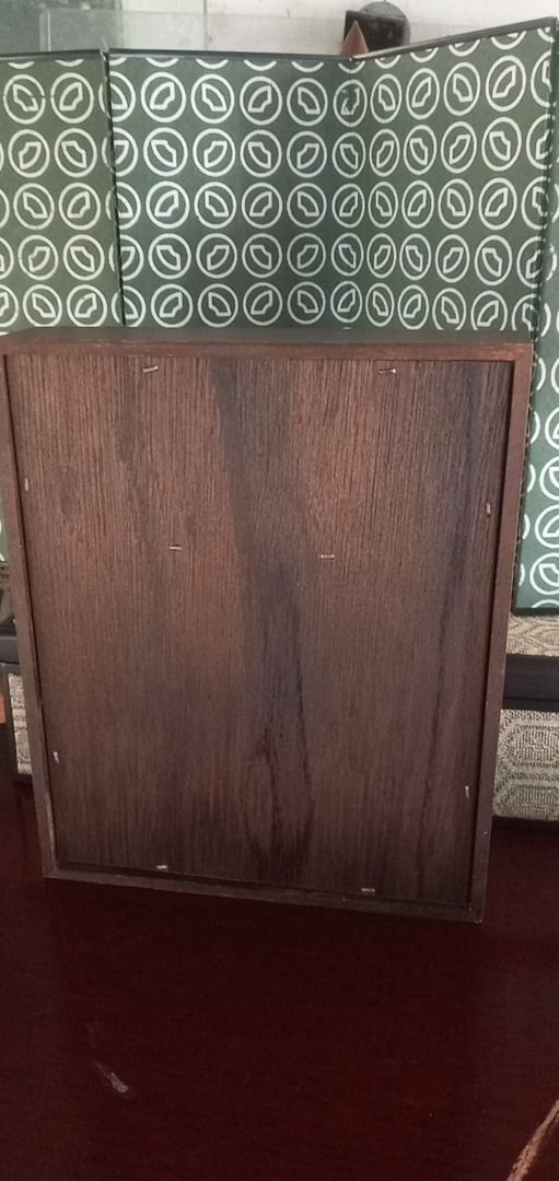Wooden storage box with picture frame (Category: Storage Boxes & Baskets) located in Paranaque City. Submitted by zuprocsejon38604 (Listing ID 1467634576, Image 3). Description: - Dark brown wooden storage box with a smooth, visible grain finish - Clear window inset on the top lid - Convenient small wooden knob pull on the front edge - Stylish neutral patterned fabric lining inside - Perfect as a desktop organizer or trinket container -Size 7.5 x