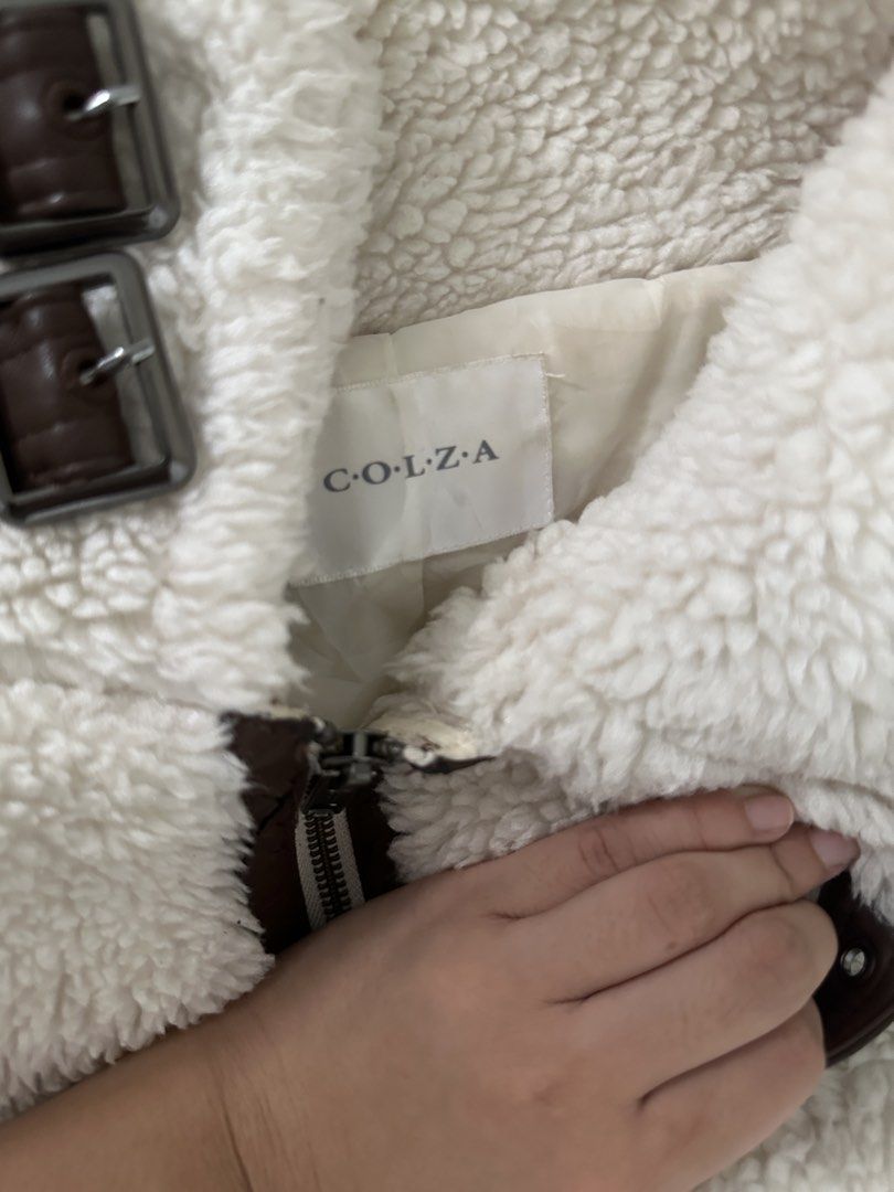 Wool Jacket (Category: Coats, Jackets and Outerwear) located in Lipa City. Submitted by chiechums (Listing ID 1467640520, Image 2). Description: - Brand: COLZA - Size: M (EU 38 / UK 10 / US 6) - Color: Off-white / Cream with brown trim and buckle details - Material: Fluffy wool/sherpa exterior with smooth inner lining - Features: High collar with double strap buckles, front zipper closure, adjustable hem buckles - Condition: Good pre-loved condit