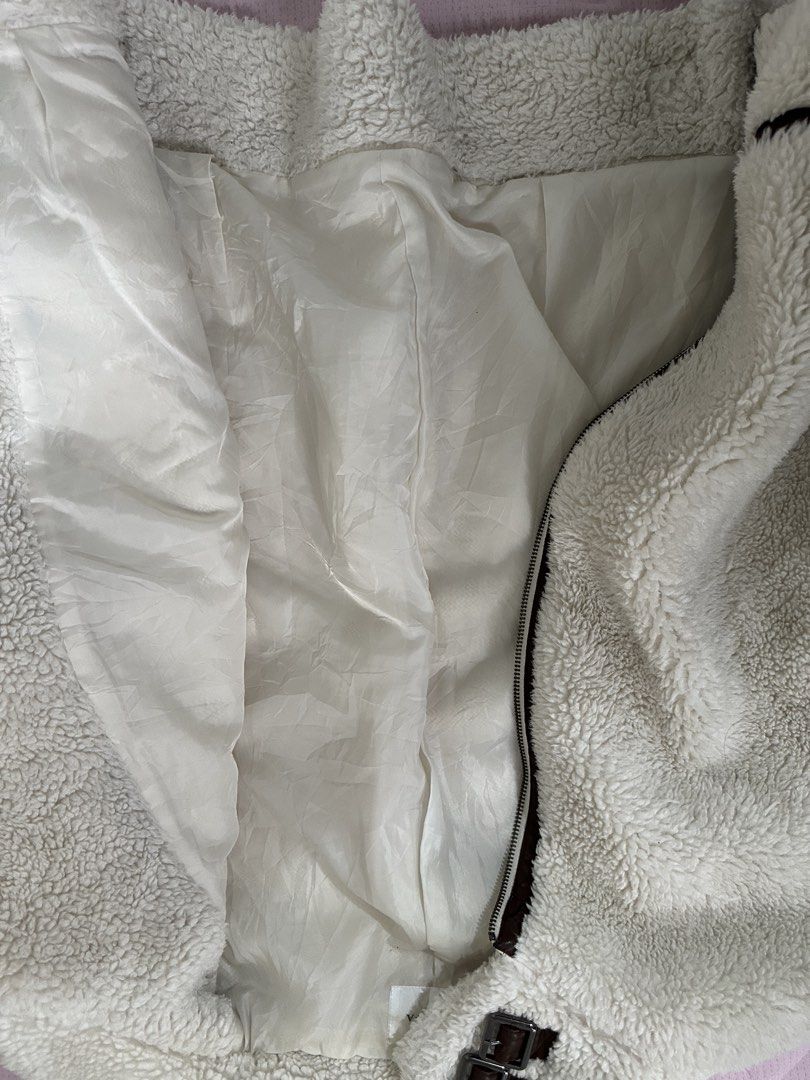 Wool Jacket (Category: Coats, Jackets and Outerwear) located in Lipa City. Submitted by chiechums (Listing ID 1467640520, Image 3). Description: - Brand: COLZA - Size: M (EU 38 / UK 10 / US 6) - Color: Off-white / Cream with brown trim and buckle details - Material: Fluffy wool/sherpa exterior with smooth inner lining - Features: High collar with double strap buckles, front zipper closure, adjustable hem buckles - Condition: Good pre-loved condit