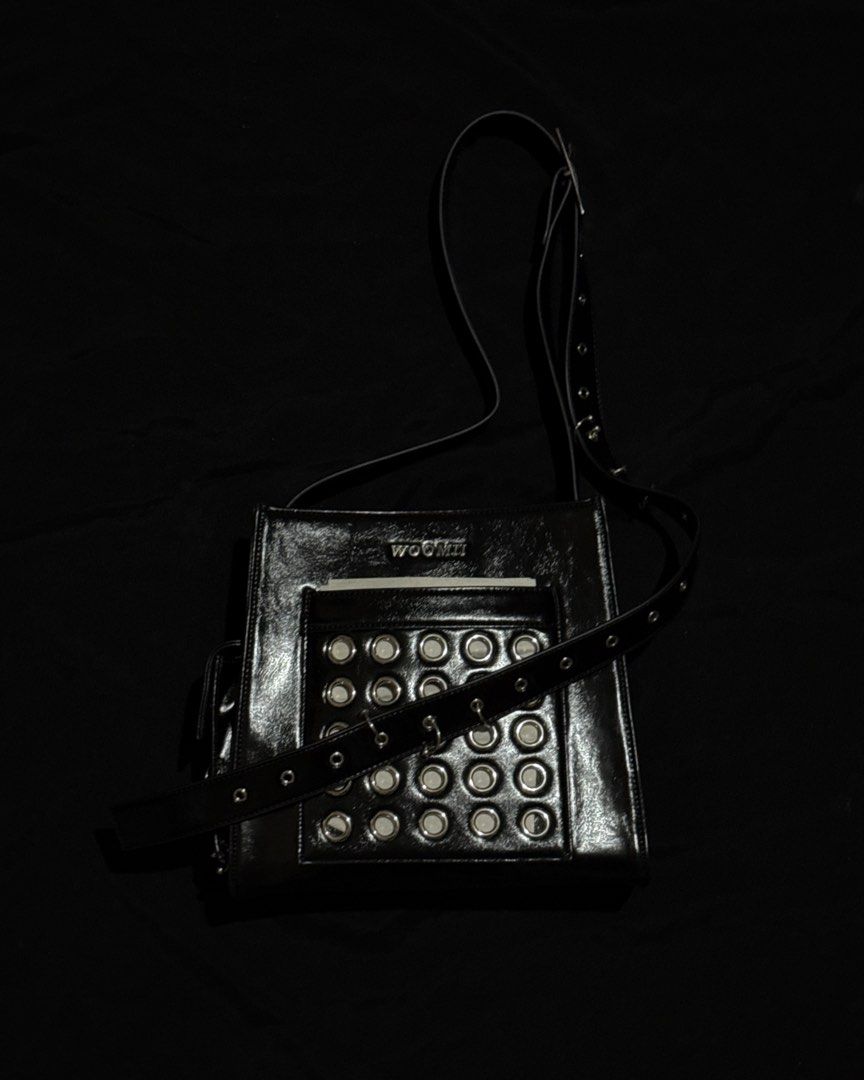 WOOMII ELI BLACK EYELET BAG (Category: Luxury Bags & Wallets) located in Guiguinto. Submitted by rlyrc_ (Listing ID 1467821636, Image 1). Description: The bag that carries it all with attitude. ELLI’s hardware details : eyelets and piercings add edge to her roomy, functional shape. Strong, bold, and made to fit more than you think. Wear crossbody for everyday cool or tighten strap to carry her over your shoulders as a handbag. (Price is negotiabl