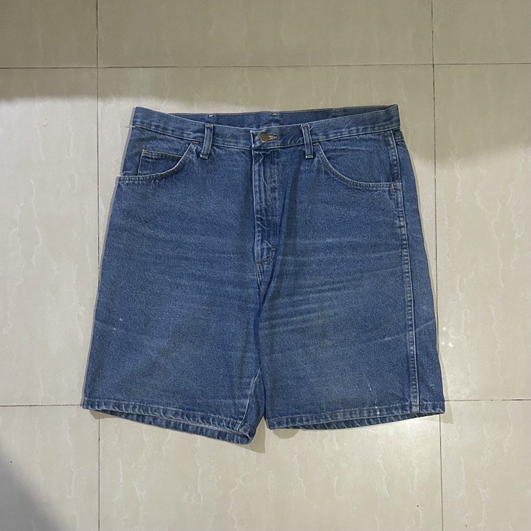 Wrangler Blue Denim Shorts (Category: Shorts) located in San Fernando. Submitted by thrift_lang_ni_kim (Listing ID 1467777229, Image 1). Description: W-38 L-21.5 Issue is stains (check photos) - Brand: Wrangler - Wash: Medium blue with slight natural fading - Fit: Mid-rise, straight leg, above-the-knee length - Details: Standard button closure, belt loops, front scoop pockets, back patch pockets - Material: Durable classic denim - Condition: Grea