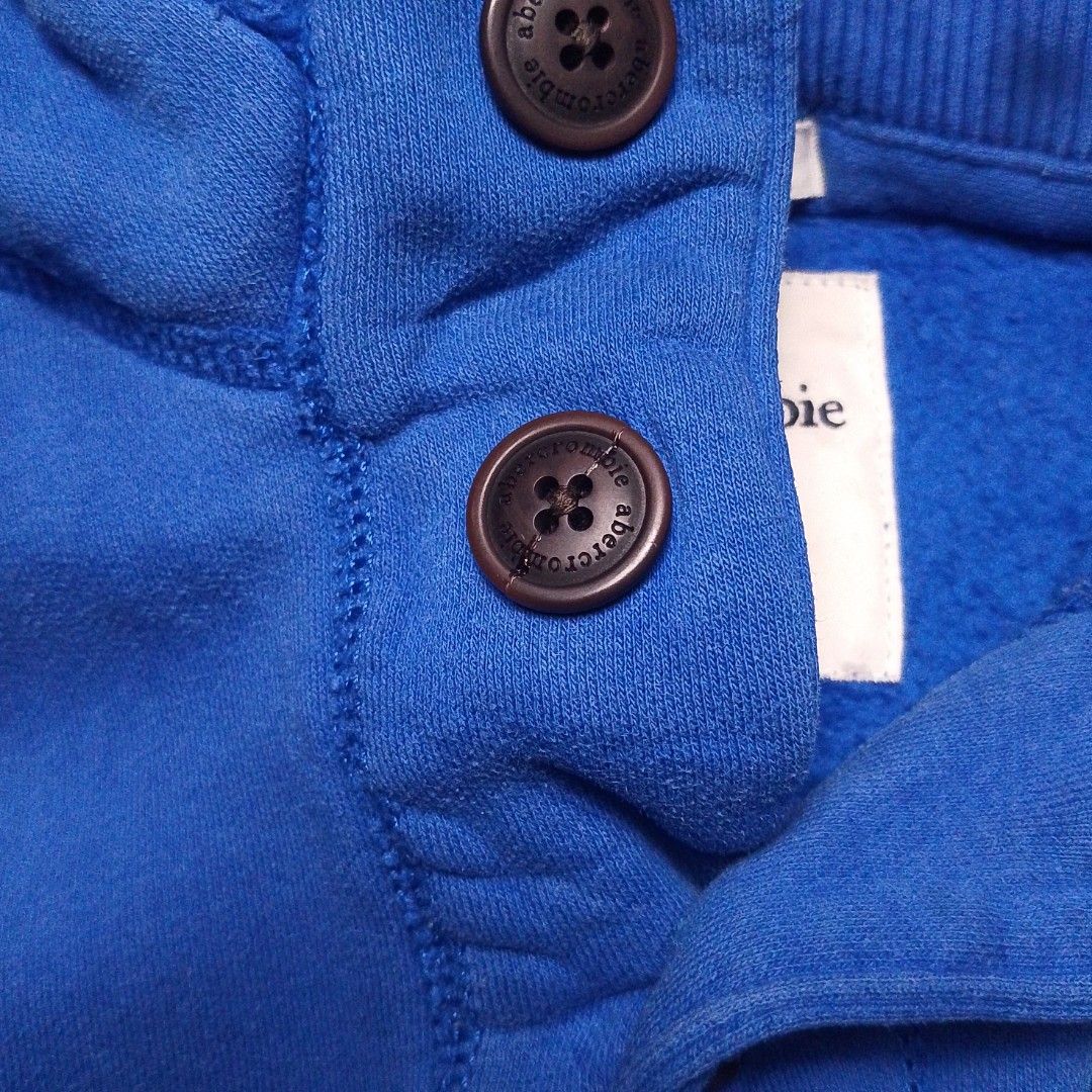 Y2k Abercrombie quarter-button hoodie (Category: Coats, Jackets and Outerwear) located in Manila. Submitted by bai.n.sell (Listing ID 1467653495, Image 2). Description: y2k Abercrombie quarter-button hoodie Size: Medium (kids on tag) fits Small-xsmall womens Width: 17, Length: 20 - Color rate8.5/10 - But still wearable ✨ THRIFTED ITEMS — PLEASE MANAGE YOUR EXPECTATIONS! All items are thrifted, so please expect possible signs of use. Colors may al